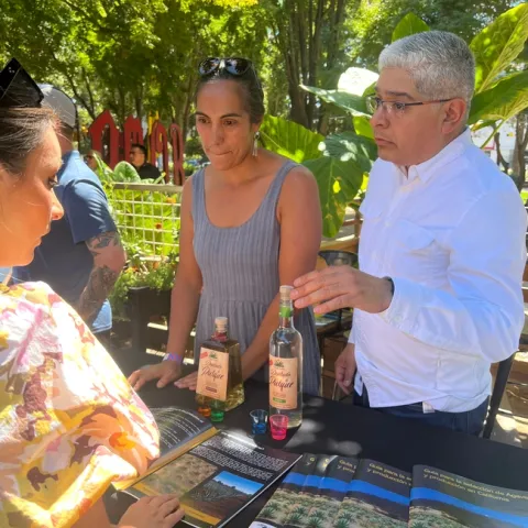 A man and woman demonstrating products made with agave.