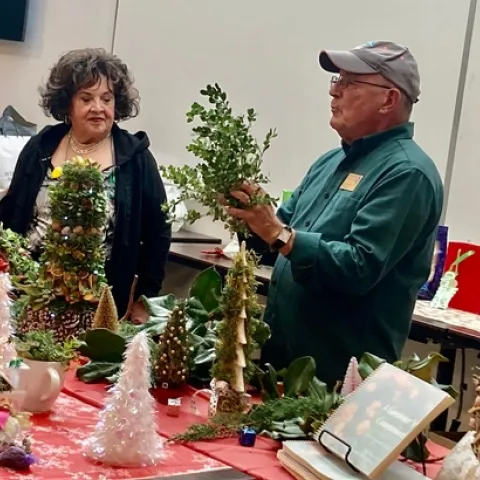 Master Gardeners Patricia Alvarado, left, and Charlie Hindes teach seniors how to decorate for the holidays on a budget. (Photos: Jeannette Warnert)