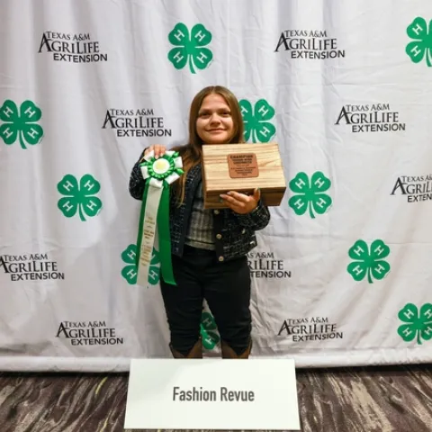 Lily with her ribbon and jewelry box awards for Overall Champion of National Fashion Revue
