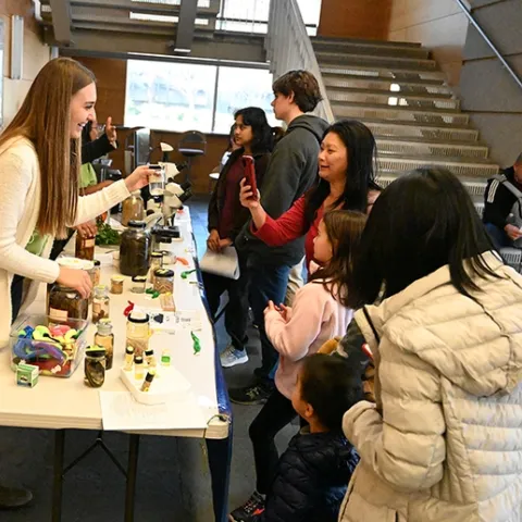 Nematologist Alison Blundell, a graduate student in the Shahid Siddique lab, shows nematode specimens at the 2023 UC Davis Biodiversity Museum Day. (Photo by Kathy Keatley Garvey)