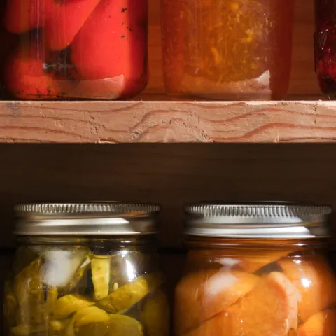 Jars of colorful preserved foods.