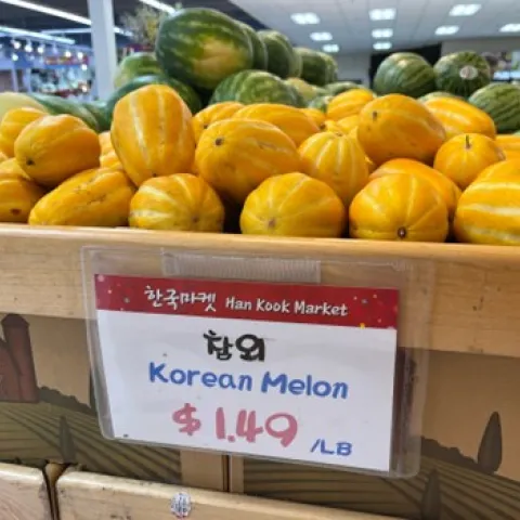 bright yellow korean melons in a market
