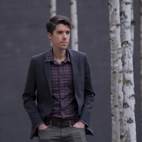 Swain walks among trees