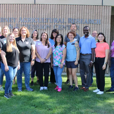 Group of people standing in front of a building.