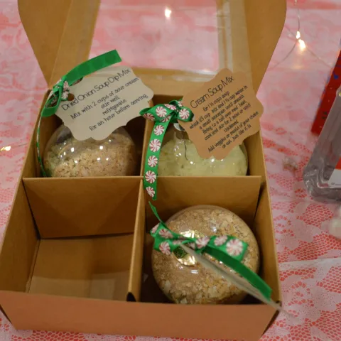 A box with christmas tree balls filled with soup mix