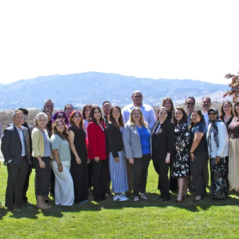 Large group standing on lawn