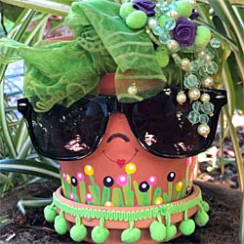 Pot decorated like a face behind sunglasses