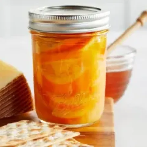 jar of sliced oranges in honey syrup