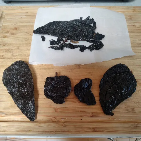 three groups of dried adobo peppers look alike