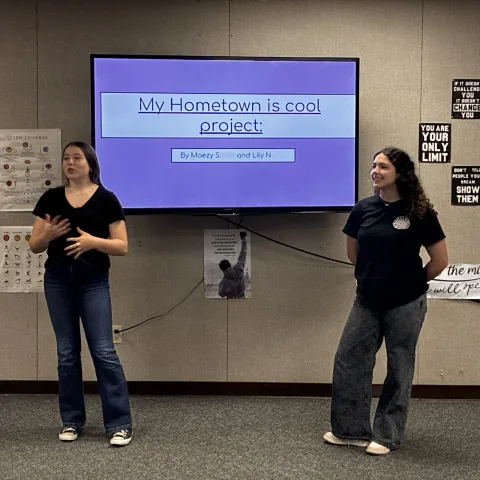 Youth give project presentations showcasing their planned projects to improve their community.