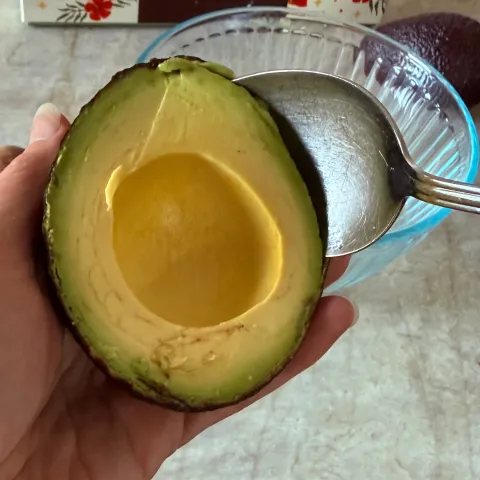 Avocado being scooped out