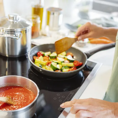 Tomato sauce and grilled zuccini on stove