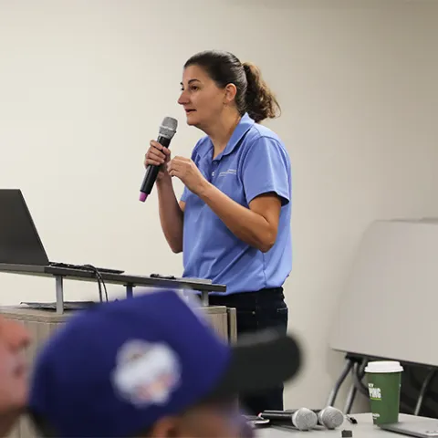Ana Pastrana Presenting at the Podium