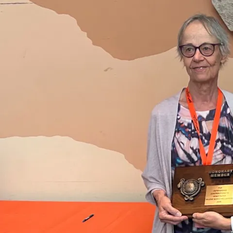 UC Davis Professor Emerita Valerie Williamson (left) receives the Society of Nematologists' Honorary Member award from Dorota Porazinska, associate professor at the University of Florida and chair of the SON Awards Committee.
