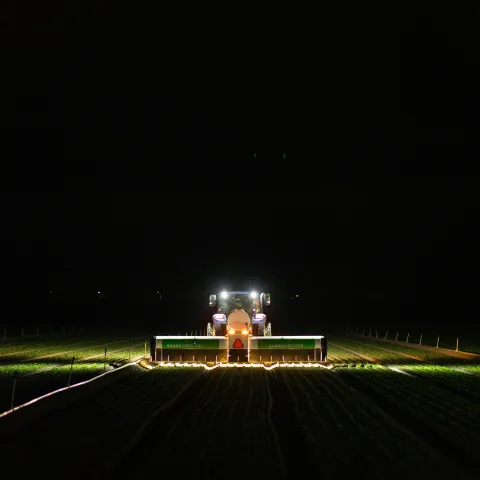 AI-powered precision application aims individual micro-shots at weeds or crops during nighttime