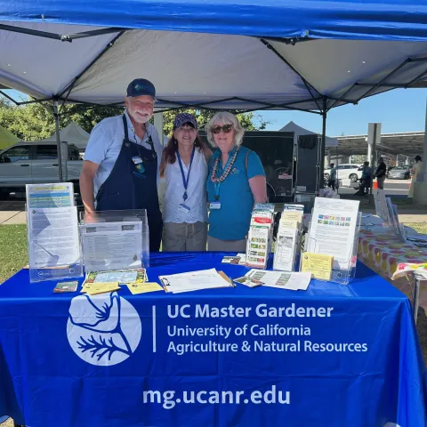 Master Gardeners at the Visalia Farmers Market in their Kiosk