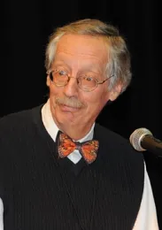 Tom Turpin adding levity to the Linnaean Games. Note the butterfly-shaped tie.