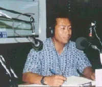 Michael Yang presents a 30-minute radio broadcast for Hmong farmers.