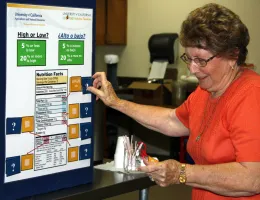Participant from the Reedley Senior Center learns how to read a food label