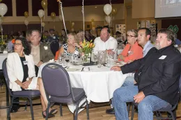 UCCE employees and community members seated at a table.
