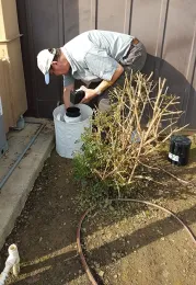 UC Davis medical entomologist Anthony Cornel with traps in Clovis. (Photo by Katherine Brisco)