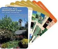 A fan of colorful Landscape Pest Identification Cards, with a garden photo on the front card.