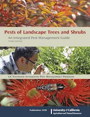 Book cover of "Pests of Landscape Trees and Shrubs," featuring a person inspecting plants, with red flowers and green foliage in the background.