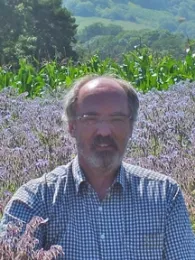 Francis Ratnieks in field of borage, Plumpton College, Plumpton, East Sussex, England.