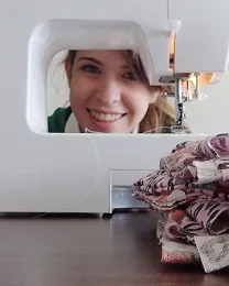 Junior leader Erica Lull spends many hours behind the sewing machine, completing her community service project. (Photo by Kathy Keatley Garvey)