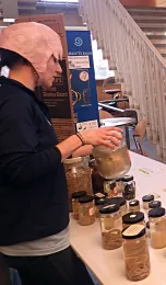 Lauren Camp wearing a nematode hat at the UC Davis Biodiversity Museum Day. (Photo by Kathy Keatley Garvey)