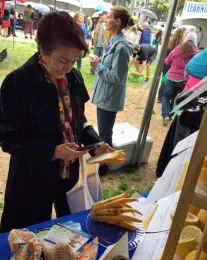 Assemblymember Anna Caballero takes a photo of the fragrant and unusual Buddha's Hand citron.