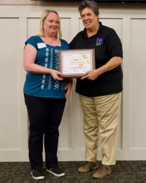 Heidi von Geldern accepts her award from VP Humiston.