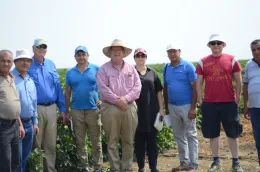 Uzbekistan tour group visiting John Diener of Red Rock Ranch in Five Points, CA