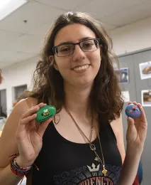 Gabby Stroubakis, a third-year sociology major at UC Davis, created these colorful rocks. (Photo by Kathy Keatley Garvey)