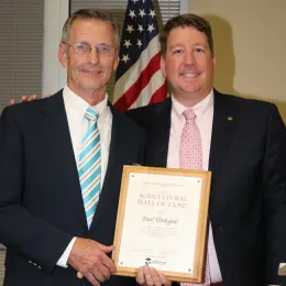 Paul Verdegaal, left, is presented with Ag Hall of Fame award by Stockton Chamber of Commerce Special Events Director/Leadership Stockton Director Timm Quinn.