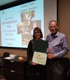 John Kabashima, right, receives urban tree award.