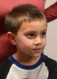 Logan Loss, 6, showed his mom described the differences between the Emperor Scorpion, Pandinus imperator, and the Dictator Scorpion, Pandinus dictator. (Photo by Kathy Keatley Garvey)
