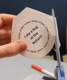 Syed Fahad Shah cuts a circle lettered with