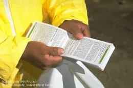 Reading pesticide label instructions. (Credit: Jack Kelly Clark)
