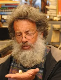 Art Shapiro holds one of the previous winners. (Photo by Kathy Keatley Garvey)