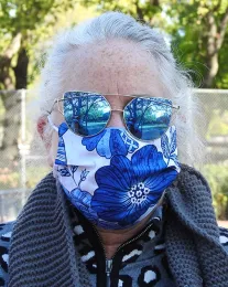 Professional seamstress Teresa Hickman goes floral with this mask. (Photo by Kathy Keatley Garvey)