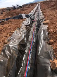 Installing Pex Pipe that will bring hot water to the heating plots and return cooled water back to the boiler.