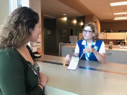 Master Gardener helping a client in 2019.