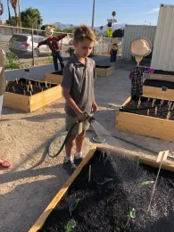 Cielo Vista Student Watering Raised Vegetable Beds