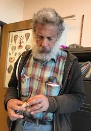 UC Davis professor Art Shapiro, with a cabbage white butterfly he netted. (Photo by Kathy Keatley Garvey)