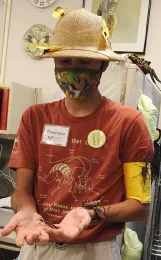 UC Davis student Francisco Basso with petting zoo tenants. (Photo by Kathy Keatley Garvey)