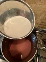 Adding sugar to lavender wine mixture