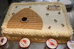 A bee-themed cake, decorated with a skep and bees and the work of CreaTions 'N Events of Sacramento. (Photo by Kathy Keatley Garvey)