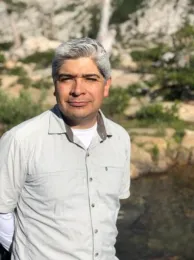 Man smiling at the camera.