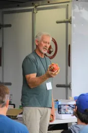 Man holding pitahaya/dragon fruit.